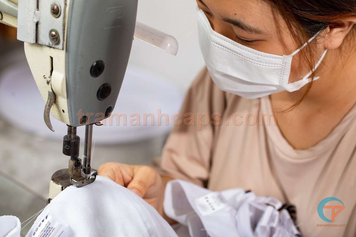 Should You Order Cheap Custom Hats? Comparing the Risks Between Low Prices and Quality 6 Cap sizing and stitch inspection at Tram Anh Caps factory – ensuring consistent quality across every unit in the batch